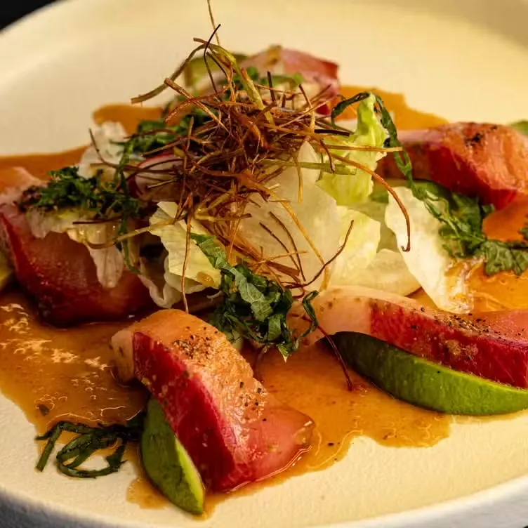 A plate of sliced sashimi prepared at Yamasaki