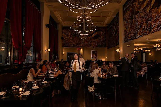 Guests being served in the Yamasaki dining room